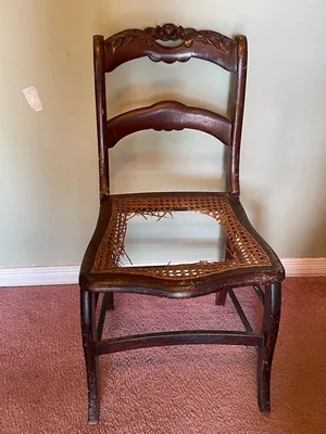 Beautiful antique solid wood chairs - carved backs / cane seats