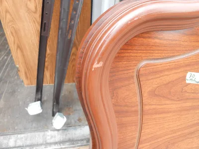 Pressed board twin head board and metal frame has marks