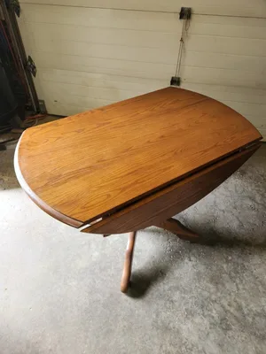 Solid oak round drop leaf table 43" Diameter and 2 oak chairs