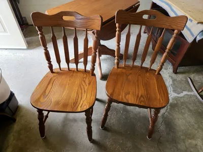Solid oak round drop leaf table 43" Diameter and 2 oak chairs