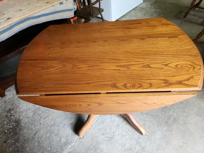 Solid oak round drop leaf table 43" Diameter and 2 oak chairs