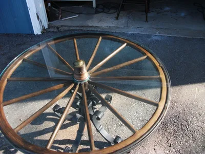 Antique Rotating Glass Top Wagon Wheel Coffee Table