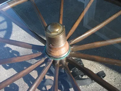 Antique Rotating Glass Top Wagon Wheel Coffee Table